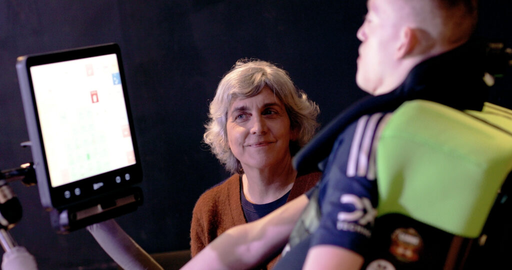 AAC user and project member discuss materials 